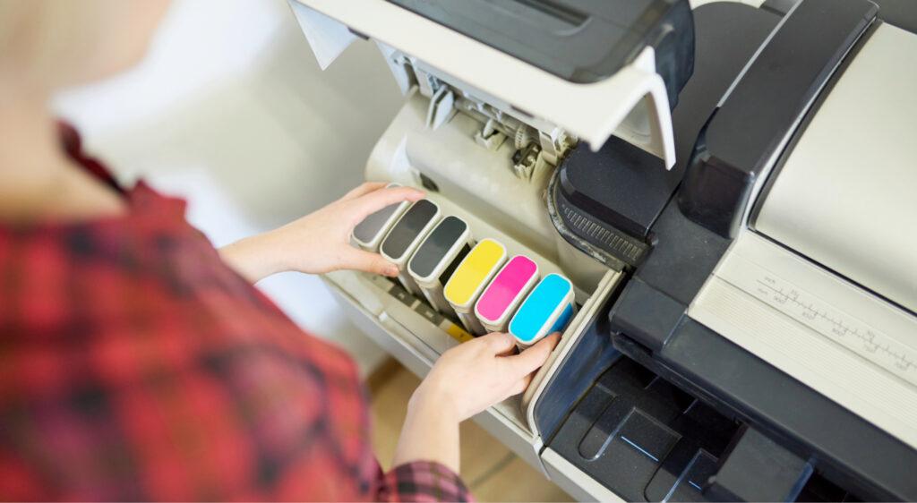inserting colour cartridges into printer machine i 2026 03 19 23 10 04 utc 1